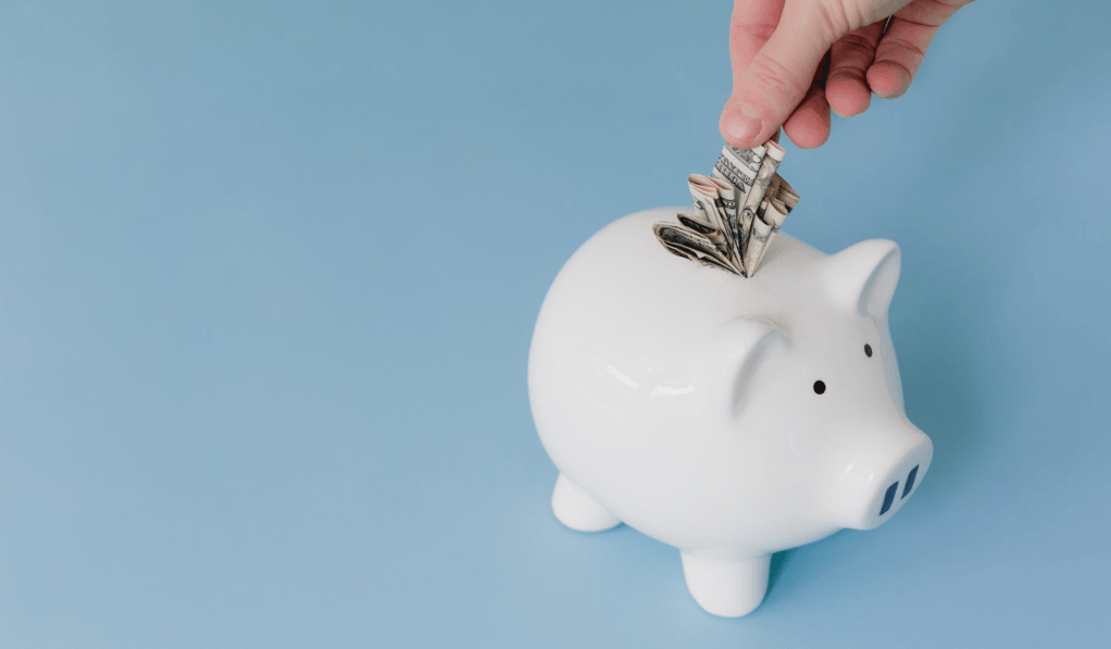 Saving money in a piggy bank